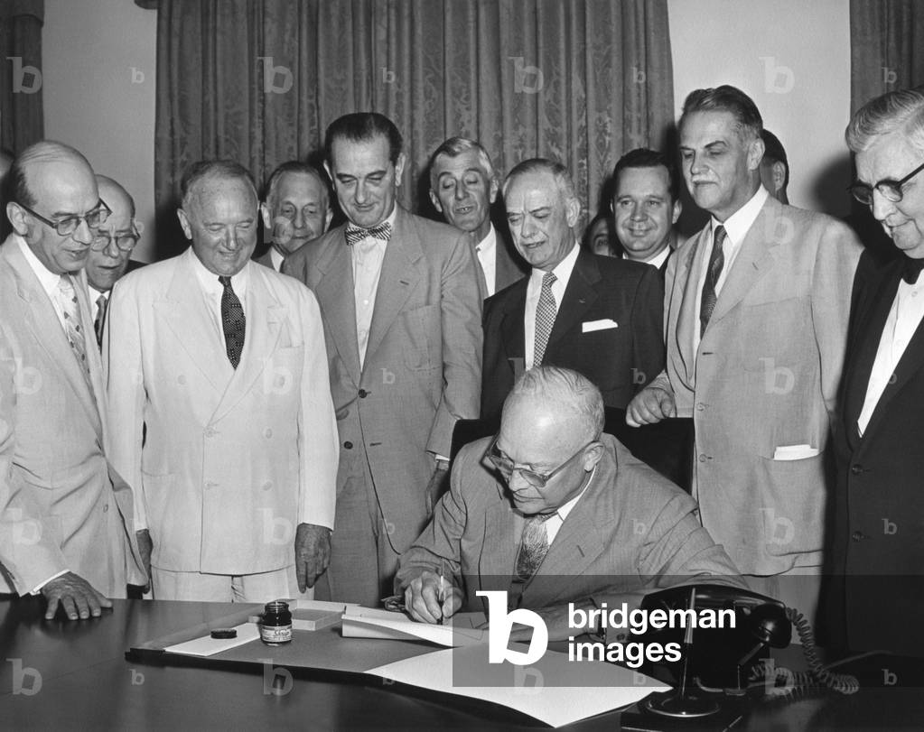 President Eisenhower signs H.R. 1 in the Cabinet Room. June 21, 1955