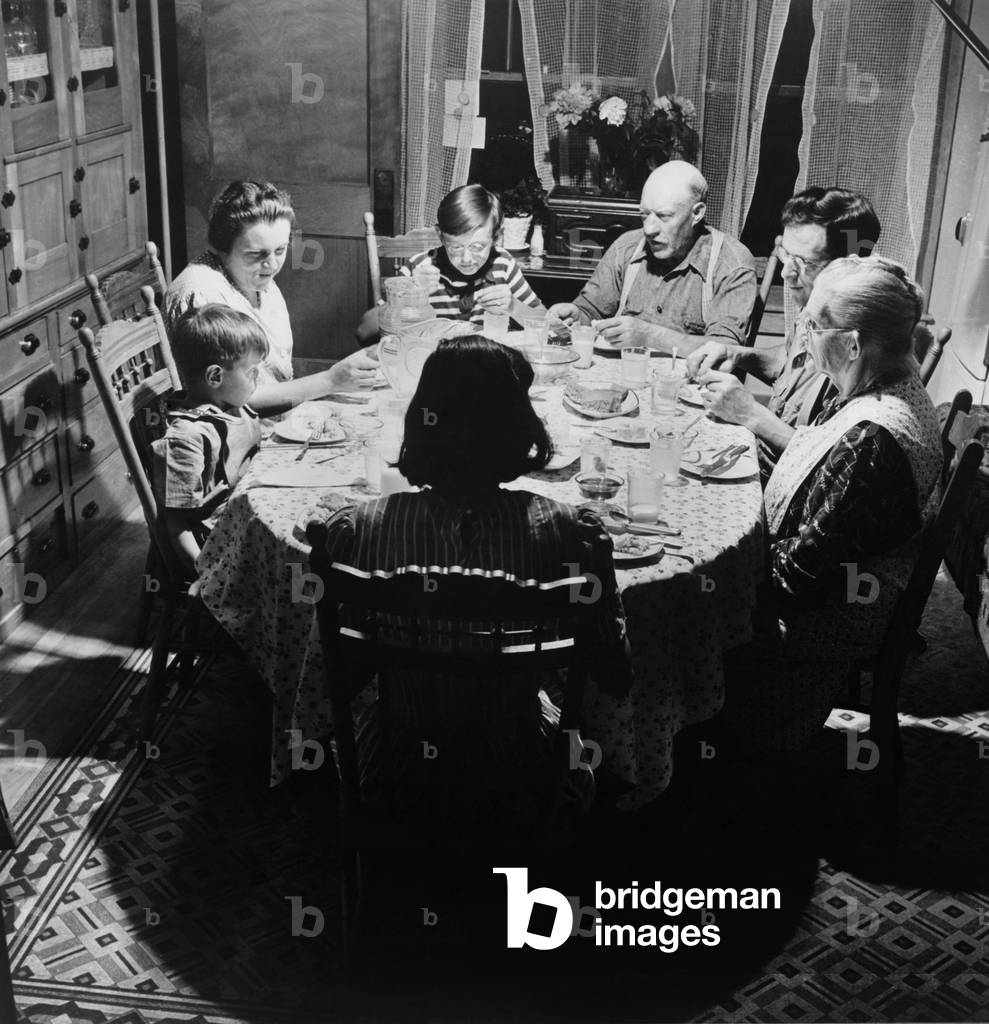 Three generations of a farm family at dinner in East Montpelier, Vermont, July 1942. Photo by Fritz Henle
