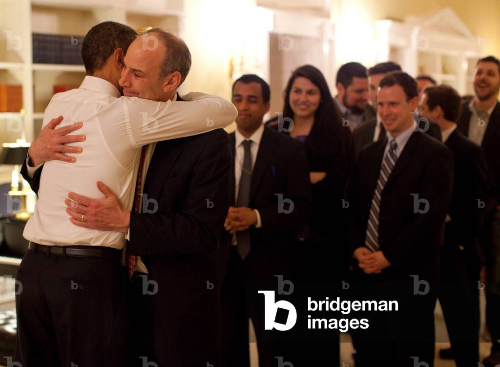 President Obama hugs Phil Schiliro assistant to the President for Legislative Affairs after the House of Representatives finally passed health care reform legislation. March 22 2010. (BSWH_2011_8_173)