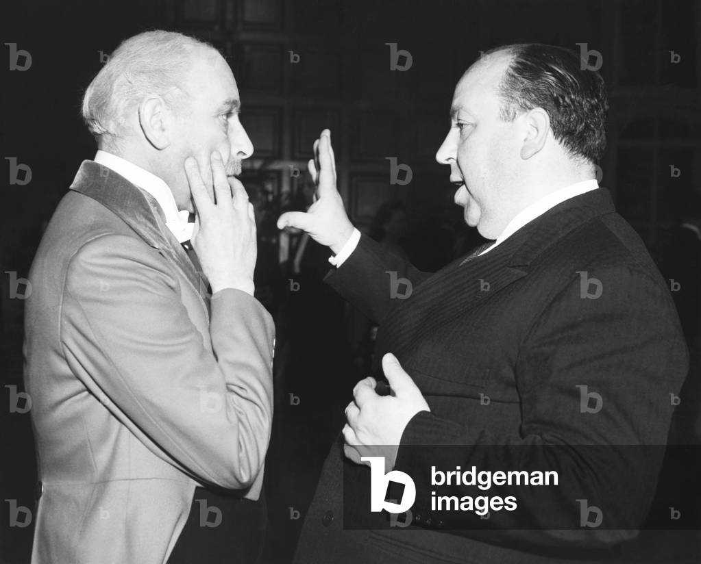 Actor Sir Cedric Hardwick and director Alfred Hitchcock on the set SUSPICION, 1941