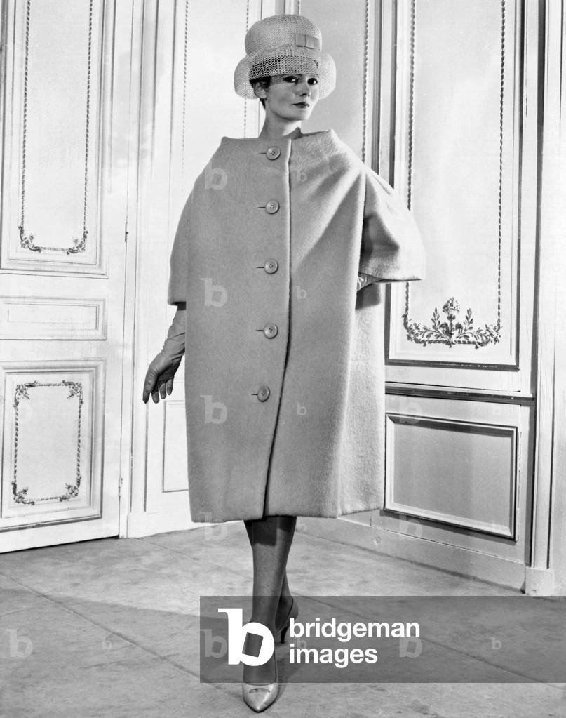 Pierre Cardin women's voluminous coat. It has simple lines, falling from the shoulders over the body, like a tent. Feb. 1959