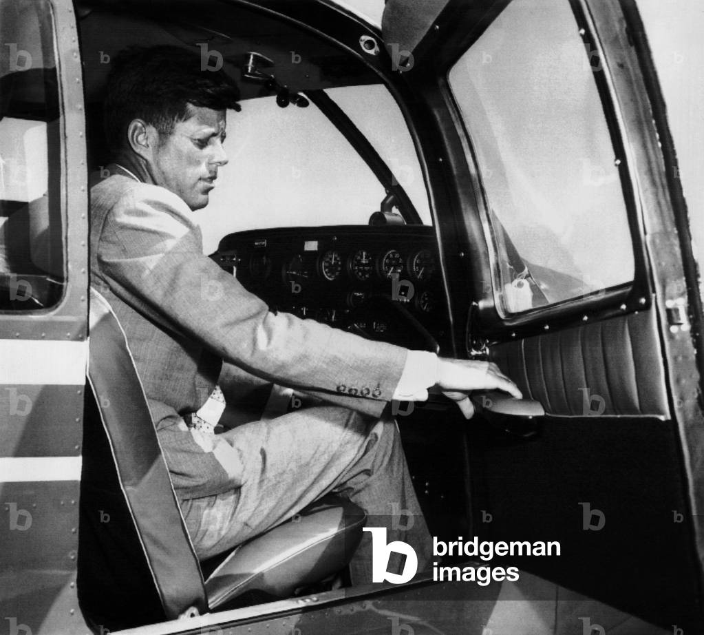Sen. John Kennedy returning from a 'bachelors' Mediterranean cruise with brother Ted Kennedy and Sen. George Smathers. While he was away, his wife, Jacqueline Kennedy gave birth to a stillborn baby girl. Aug. 8, 1956