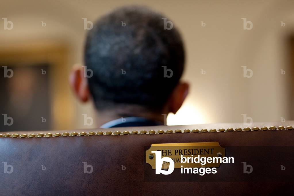 Back of President Barack Obama's head in his Cabinet Room chair with a plaque noting the date of his inauguration. Jan. 29 2010.,