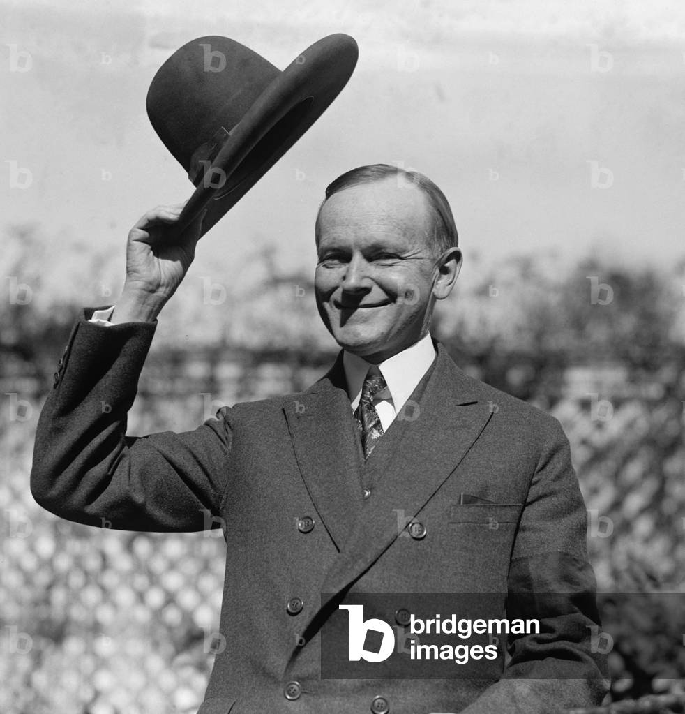 President Calvin Coolidge waves a hat presented to him by Smoki People of Prescott, Arizona. c. Sept-Oct. 1924.