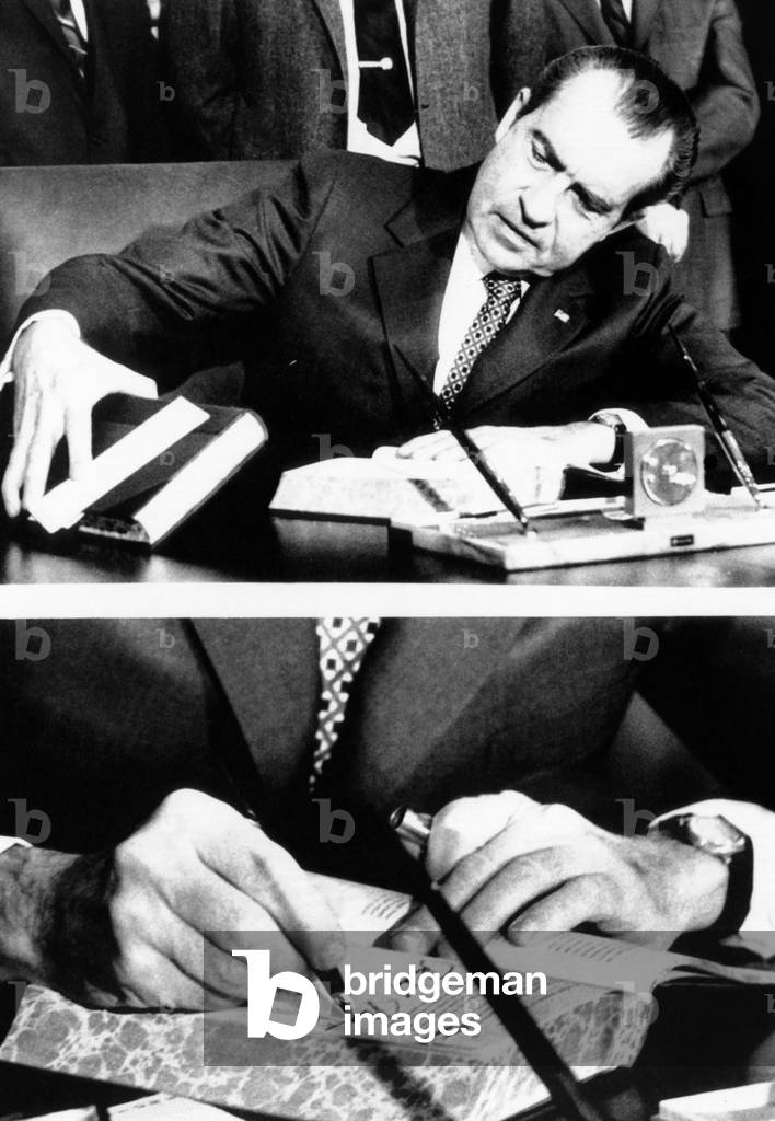 President Richard Nixon signing the budget for fiscal 1972 which he is sending to Congress, 1972