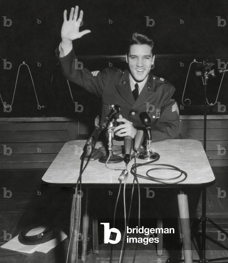 Sgt. Elvis A. Presley answers question for the civilian and military press. March 1, 1960. When asked why he served as a regular soldier instead of as part of the service club, he said, 'People were expecting me to mess upI was determined to go to any limits to prove otherwise'.