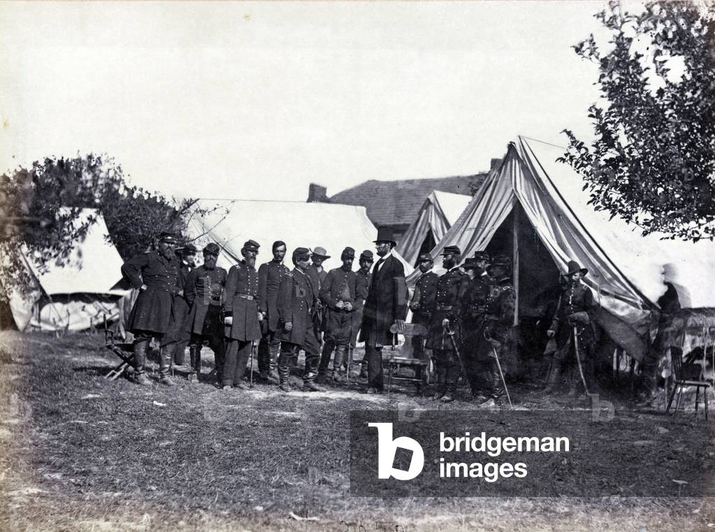 President Lincoln (1809-1865) on battle-field of Antietam with several officers outside tent, c.1860 (photo)