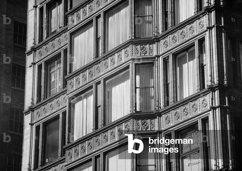 Reliance Building (1890), is an example of the early Chicago School by architects, Burnham & Root and Charles B. Atwood. The undisguised cage of structural steel allows large windows, and ceramic surface decoration