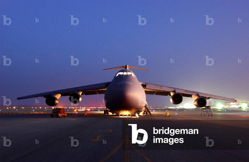 A U.S. Air Force C-5 Galaxy aircraft parked on the flight line at an undisclosed location in support of U.S. military operations in Afghanistan. May 12 2002, Photo by:Everett Collection