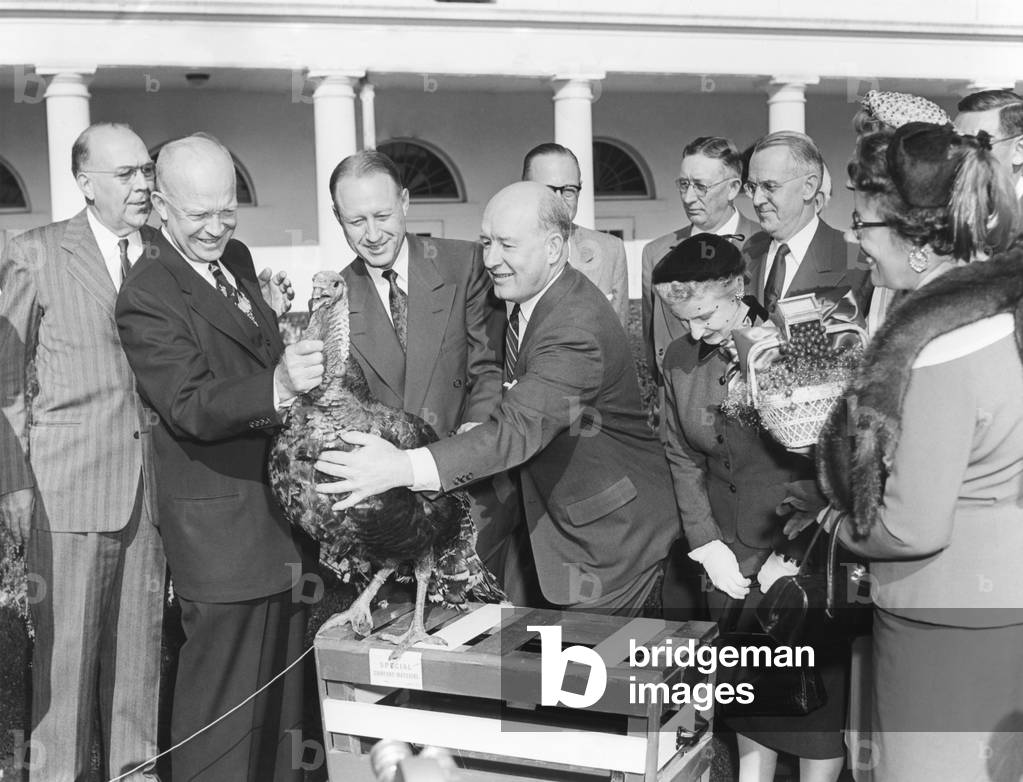President Dwight Eisenhower receives a turkey from members of the National Turkey Federation at the White House. Nov. 16, 1953.