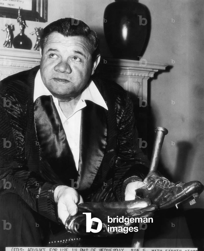 New York Yankees. Retired outfielder Babe Ruth, with bronzed glove, shoes and bat, 1946