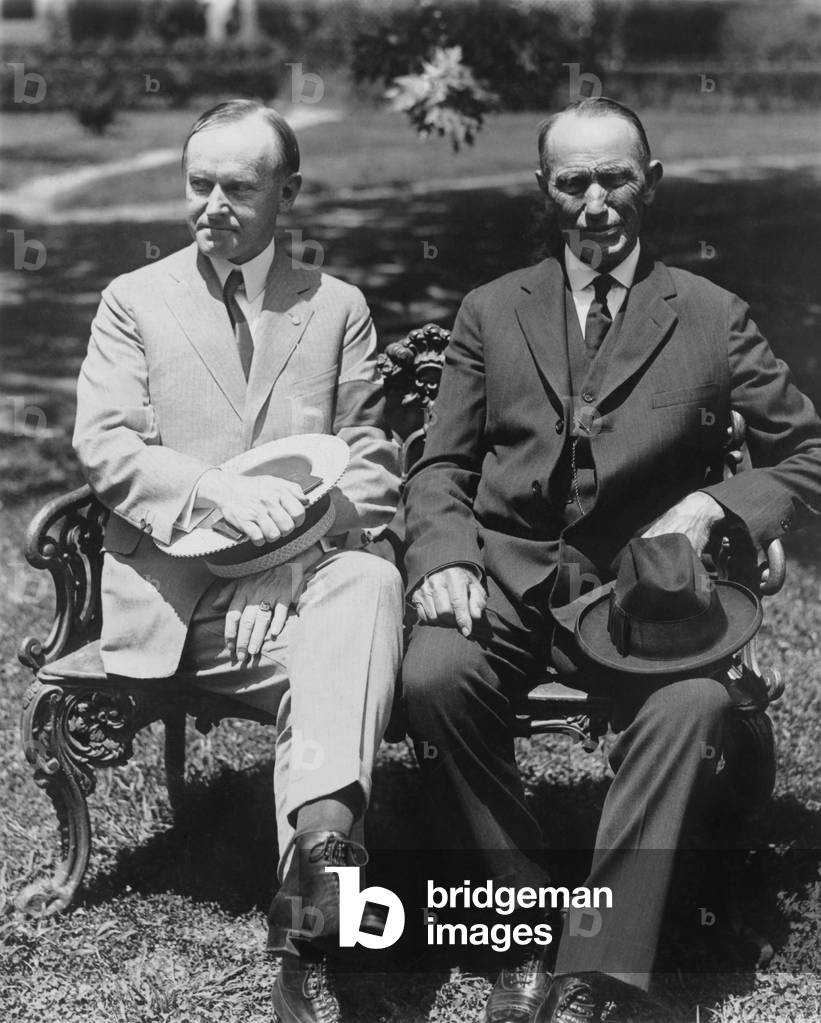 President Coolidge and his father, George Tryon Harding, Sr. seated on the White House lawn. July 1924, shortly after the death of the President's 16 year old son, Calvin Coolidge Jr