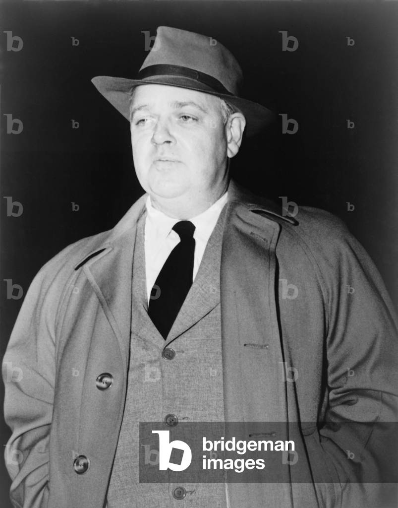 Whittaker Chambers, leaving Federal Court, Nov. 18, 1949, during the second perjury trial of Alger Hiss. An admitted former Communist, Chambers testified he had known Hiss as a fellow member of a communist spy ring in the 1930s