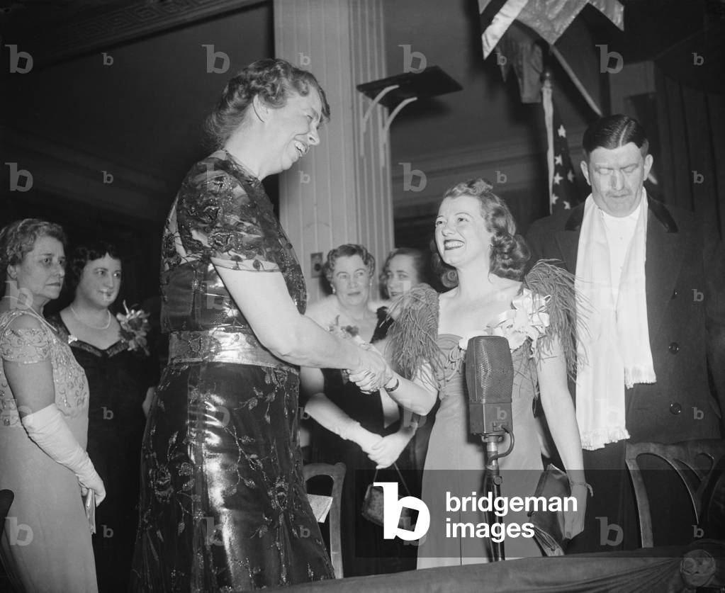 Eleanor Roosevelt greets actress Janet Gaynor at the President's Birthday Ball, January 29, 1938. Wardman Park Hotel, Washington, D.C. The Annual Roosevelt Birthday Ball was a fundraiser for the March of Dimes' fight against polio