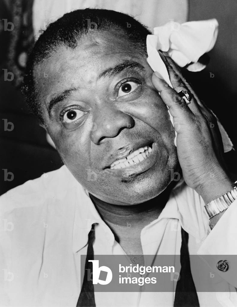 Louis Armstrong (1901-1971), African American Jazz musician, with his signature handkerchief in 1953