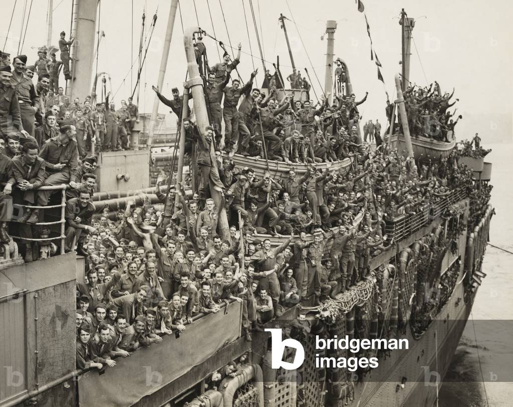After victory in Europe, the Troops of the 20th Armored Division and units of the 9th Army whoop it up as the SS John Ericsson nears it pier on New York City's Hudson River. August 6, 1945