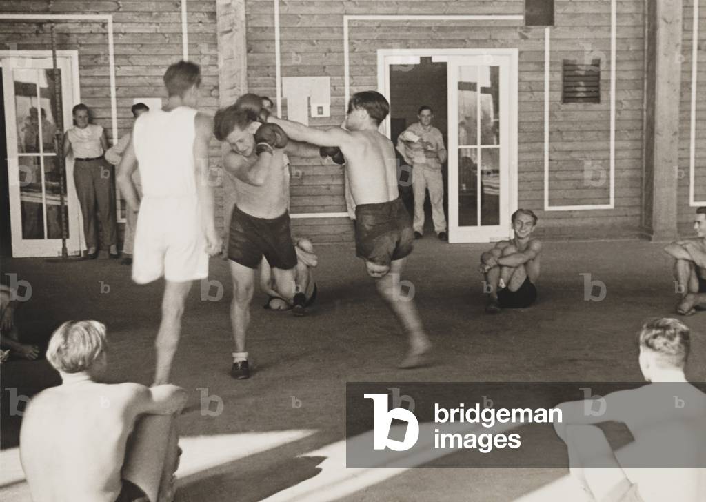 German amputees boxing at military hospital. The young World War 2 veterans were in rehabilitation near Vlasim, Czech Republic. 1943