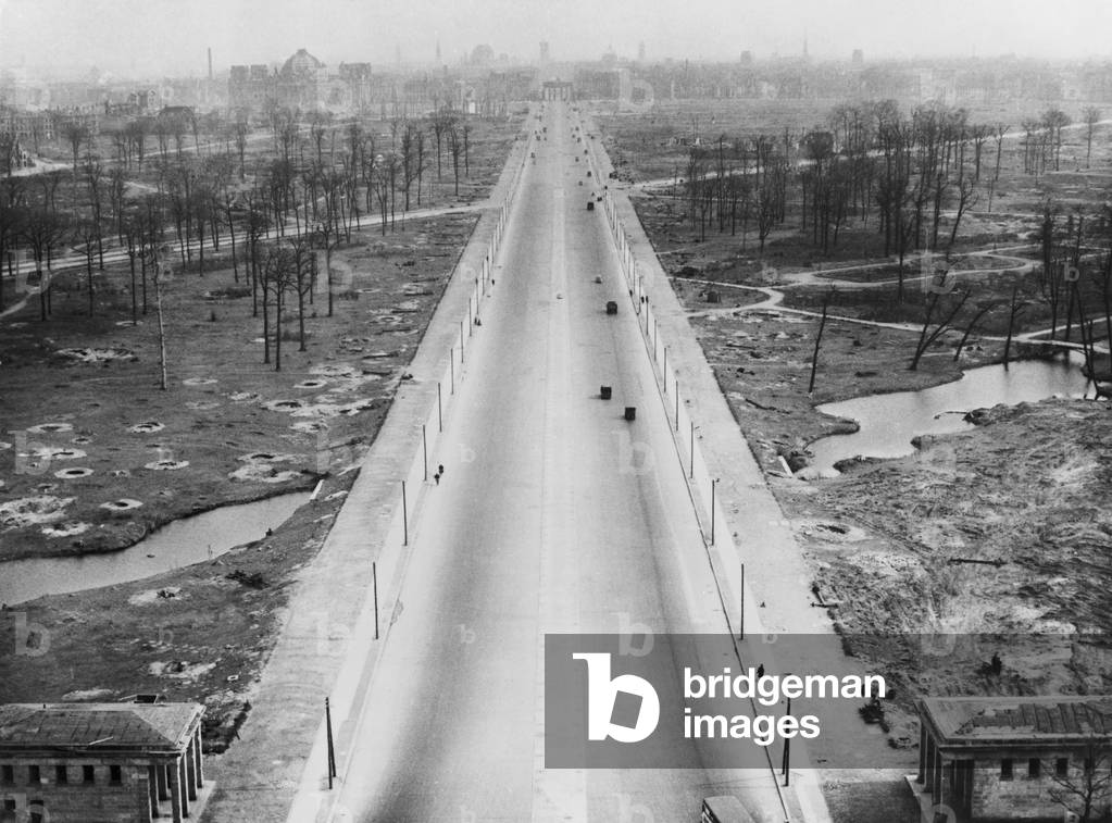 Tiergarten Park and the boulevard leading to the Brandenburg Gate after World War 2. The landscape is filled with bomb craters from the war. Berlin, Germany. c. 1945-46.