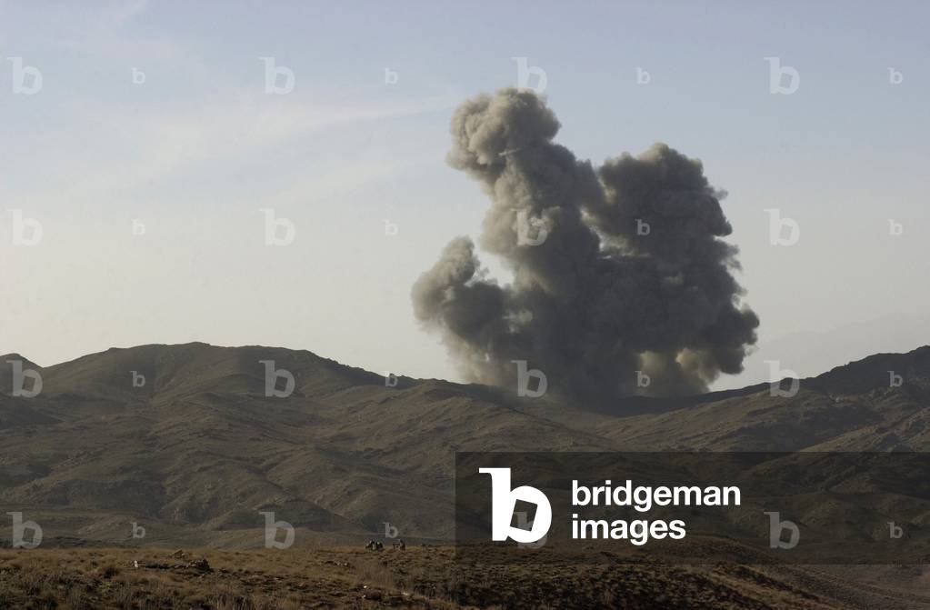 An enemy position in Afghanistan's Gardez Valley is destroyed by smart bombs dropped by B-52 bombers attacking al-Qaeda and Taliban forces. Mar. 10 2002., Photo by:Everett Collection