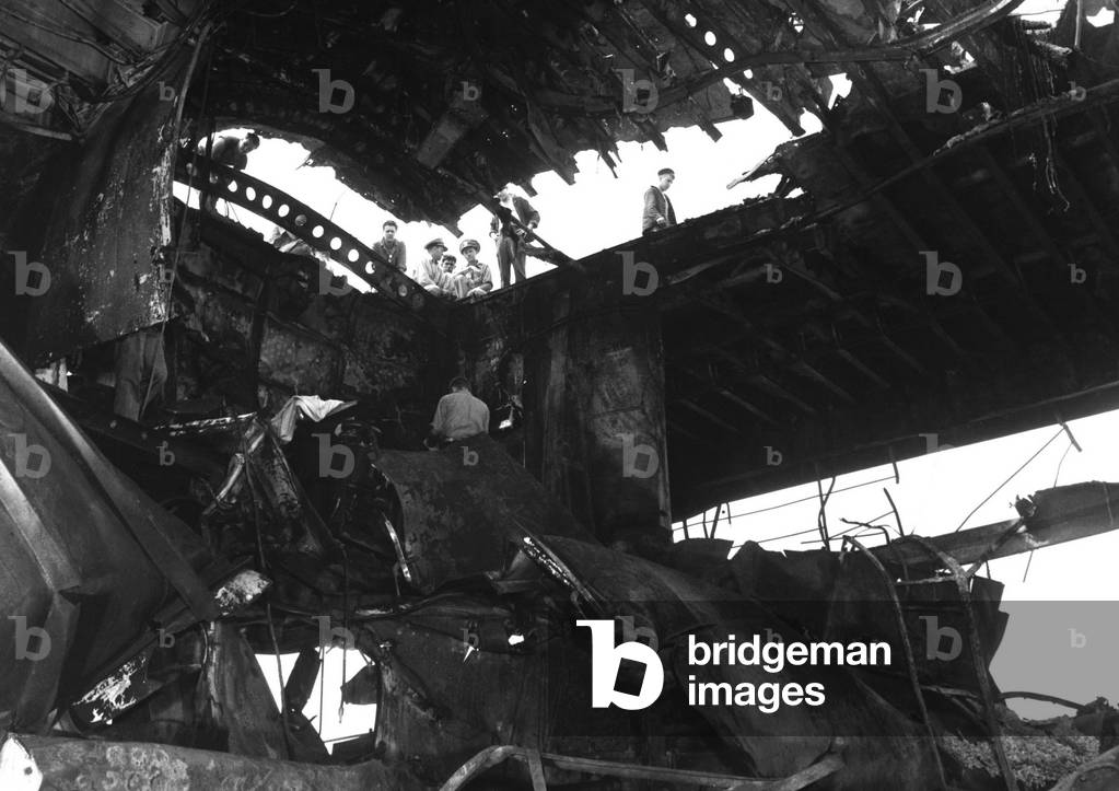 USS Randolph aircraft carrier after a strike by a Japanese Kamikaze suicide plane. The flight deck and hanger were damaged while she was anchored at Ulithi Atoll. March 11, 1945. World War 2