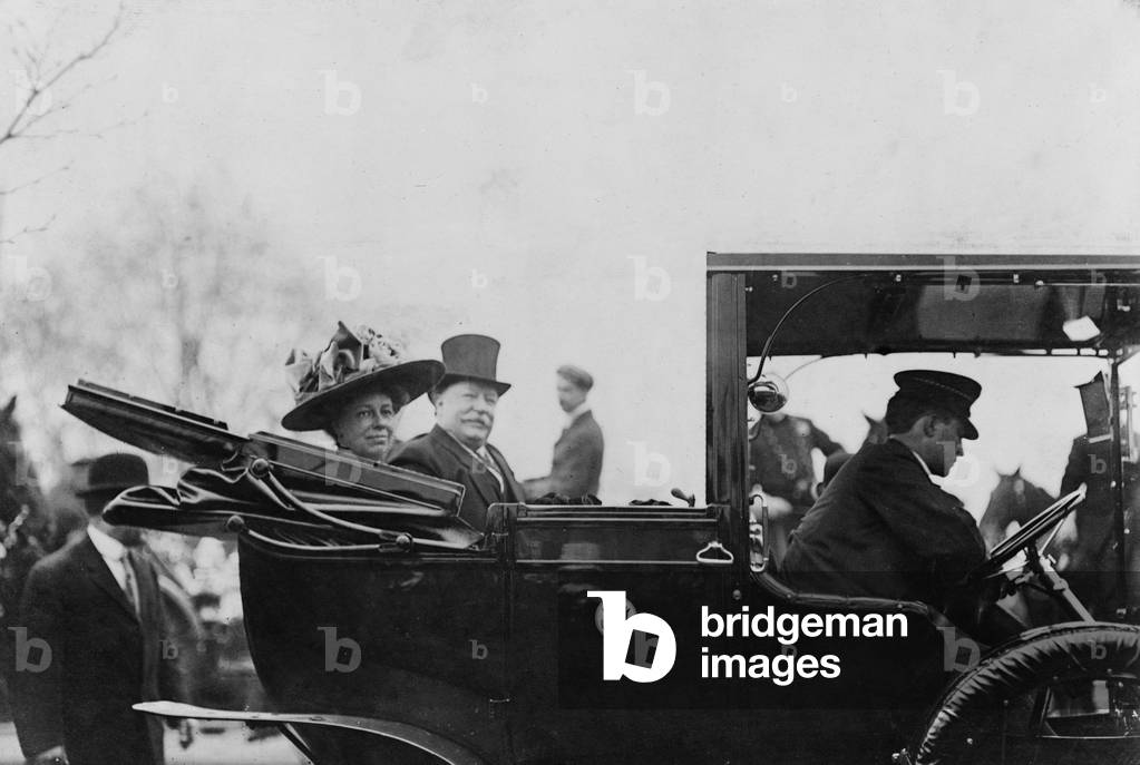 President William Taft (1857-1930) and First Lady, Helen Taft, seated in the back of an open convertible automobile in 1909