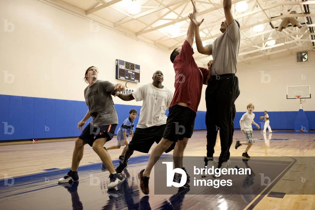 President Barack Obama plays basketball with senior staff and their family members during a retreat at Camp David on July 18 2009.,