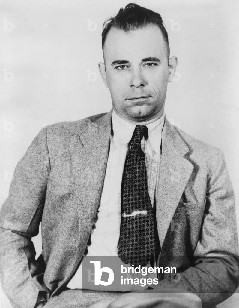 John Dillinger (1903-1934), famous bank robber, in police custody in September 1933, would soon be freed by five former convict pals from the Indiana State Prison. Dillinger has been portrayed by several actors: Lawrence Tierney, 1945; Nick Adams, 1965; Ben Johnson, 1973; Richard Dreyfuss, 1973; and most recently by Johnny Depp, in PUBLIC ENEMIES, 2009