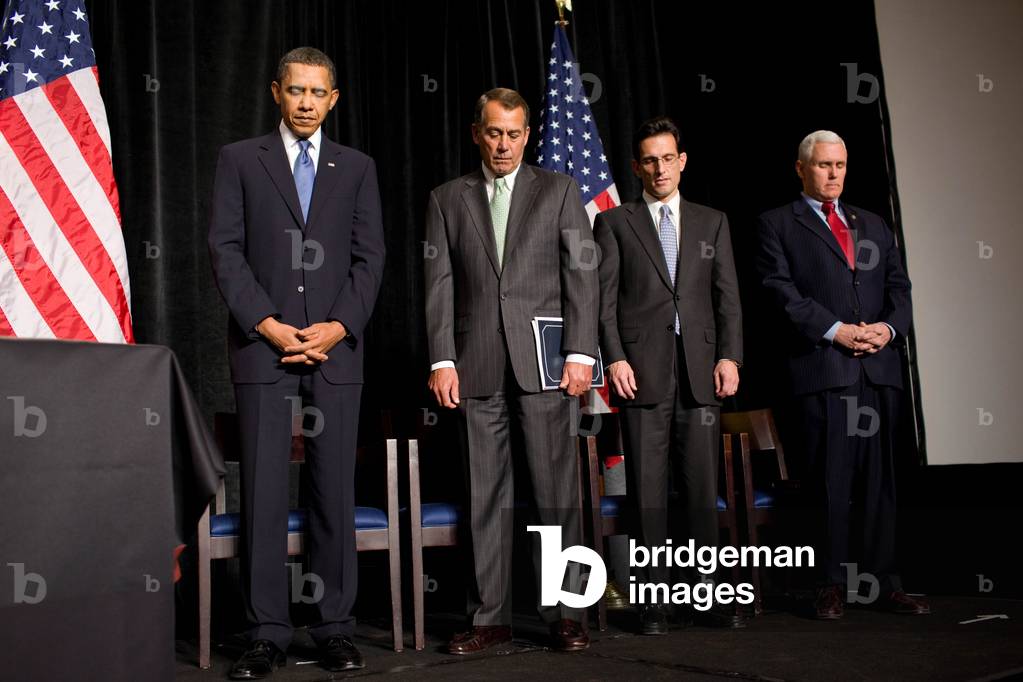 President Obama bows his head during the invocation at the nationally televised Republican House Issues Conference in Baltimore. L to R President Obama John Boehner Eric Cantor Mike Pence. Jan. 29 2010. (BSWH_2011_8_129)