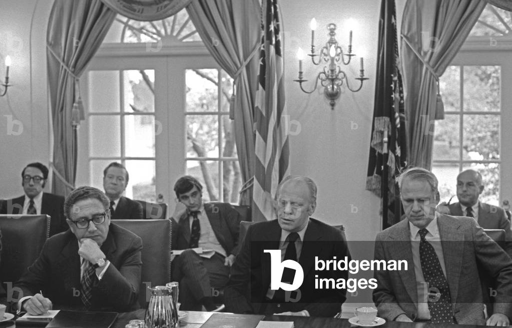 President Ford flanked by Sec. of State Henry Kissinger left and Sec. of Defense James Schlesinger right at a bipartisan meeting with congressional leaders during the final fall of South Vietnam. April 29 1975