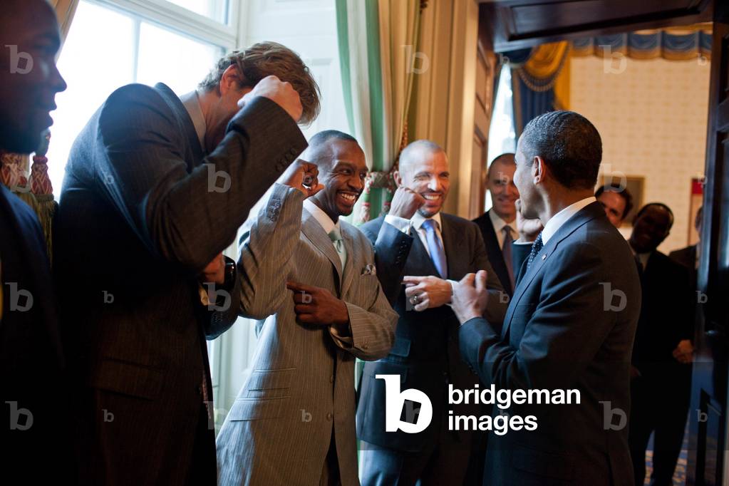 President Barack Obama jokes with Dallas Mavericks basketball players. The 2011 NBA Champions were honored at the White House on Jan. 9, 2012