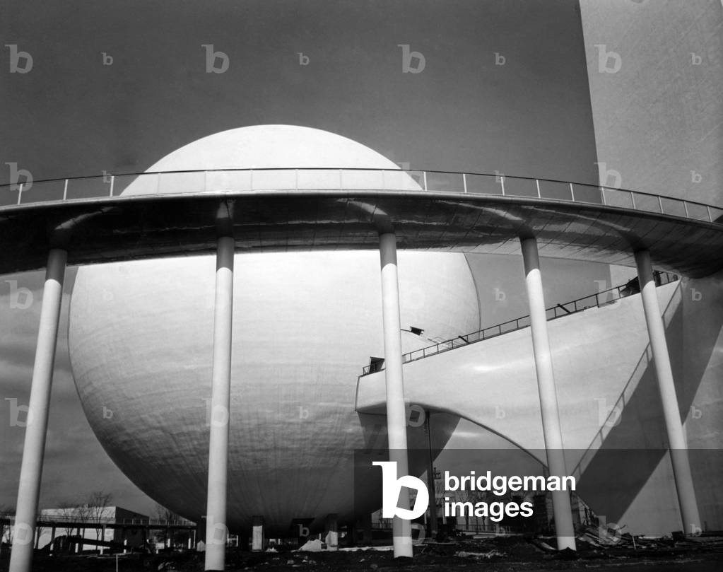 The Perisphere, an 18-story globe housing theme exhibit at the 1939 New York World's Fair, at the front is the Helicline, a curved ramp from the exhibit, Flushing, New York