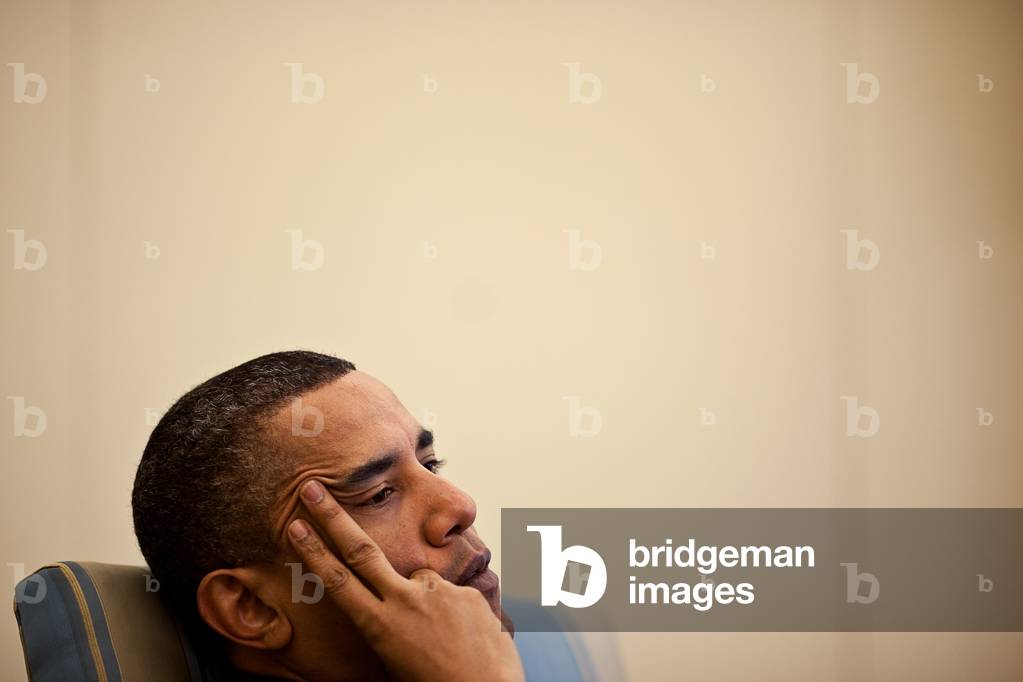 President Barack Obama listening during an Oval Office meeting with his senior advisors. April 14 2010.,