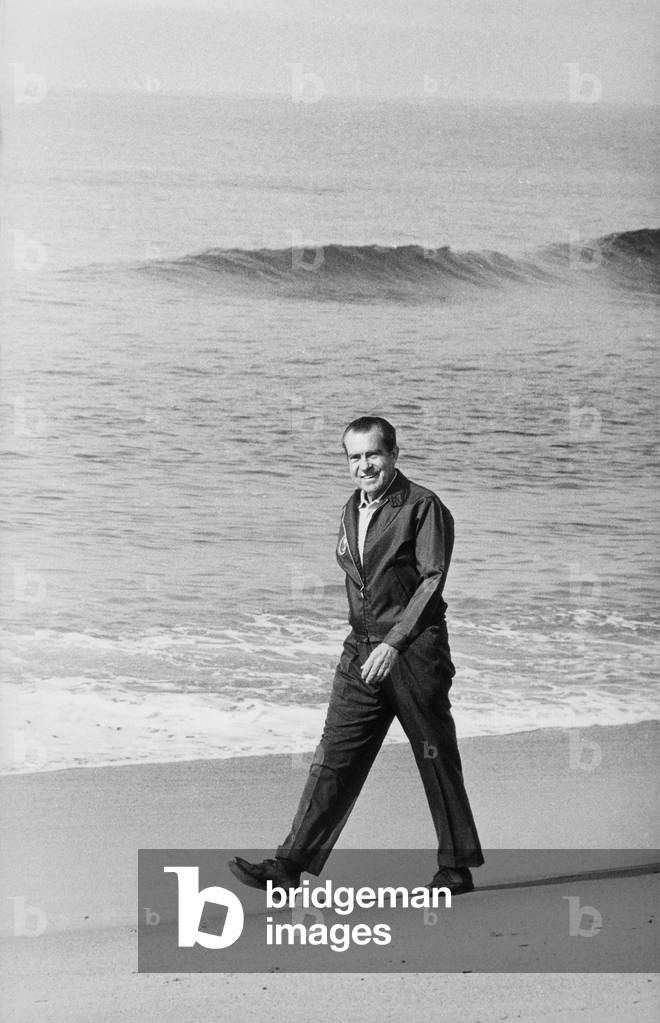 Richard Nixon walking on the beach in San Clemente. c. 1969-74