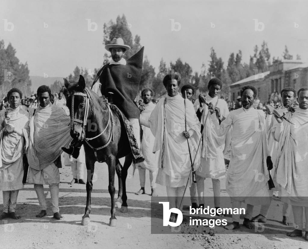 Haile Selassie on horseback surrounded by bodyguards, Addis Ababa, Ethiopia