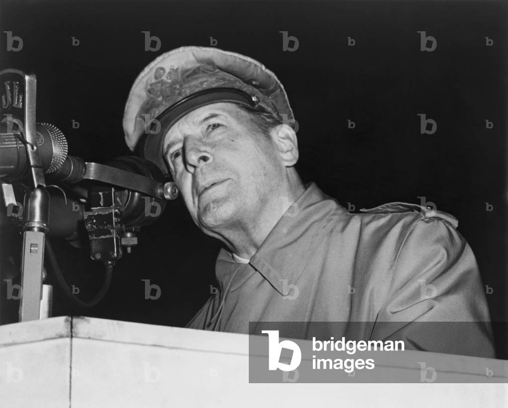 General Douglas MacArthur addressing an audience of 50,000 at Soldier's Field, Chicago on April 26, 1951. He simplified the complexities of the Korean War, advocating 'victory over the nation and men who, without provocation, have attacked us.'