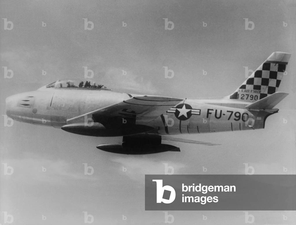 F-86 Sabre Jet was the first U.S. jet fighter to have swept wings. This one is headed toward 'MIG Alley' in north west North Korea on the Yalu River, the site of dogfights between UN fighter and Communist pilots. The Sabre jet was the U.S. jet that best matched the Soviet MiG. Korean War, 1950-53