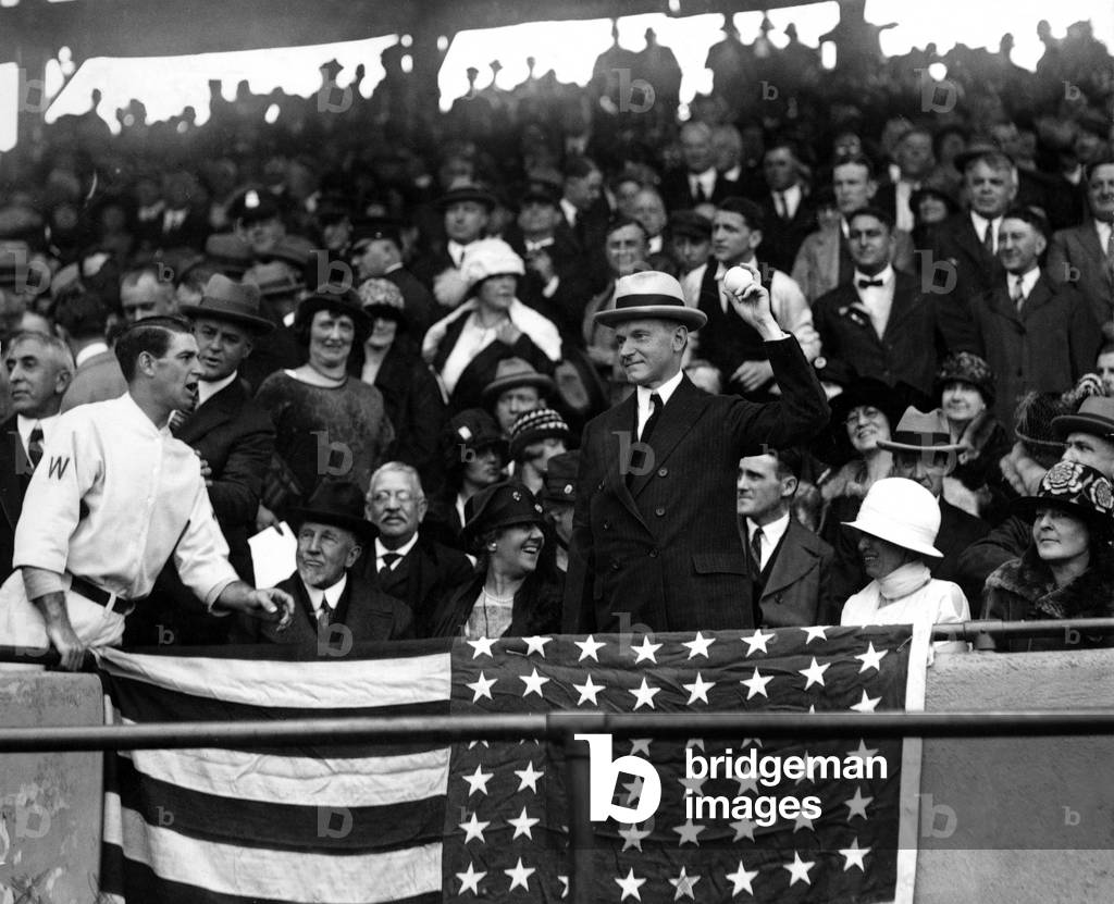 President Calvin Coolidge pitches the first ball to start the 1924 World Series , Washington Senators vs NY Giants, 10/5/24