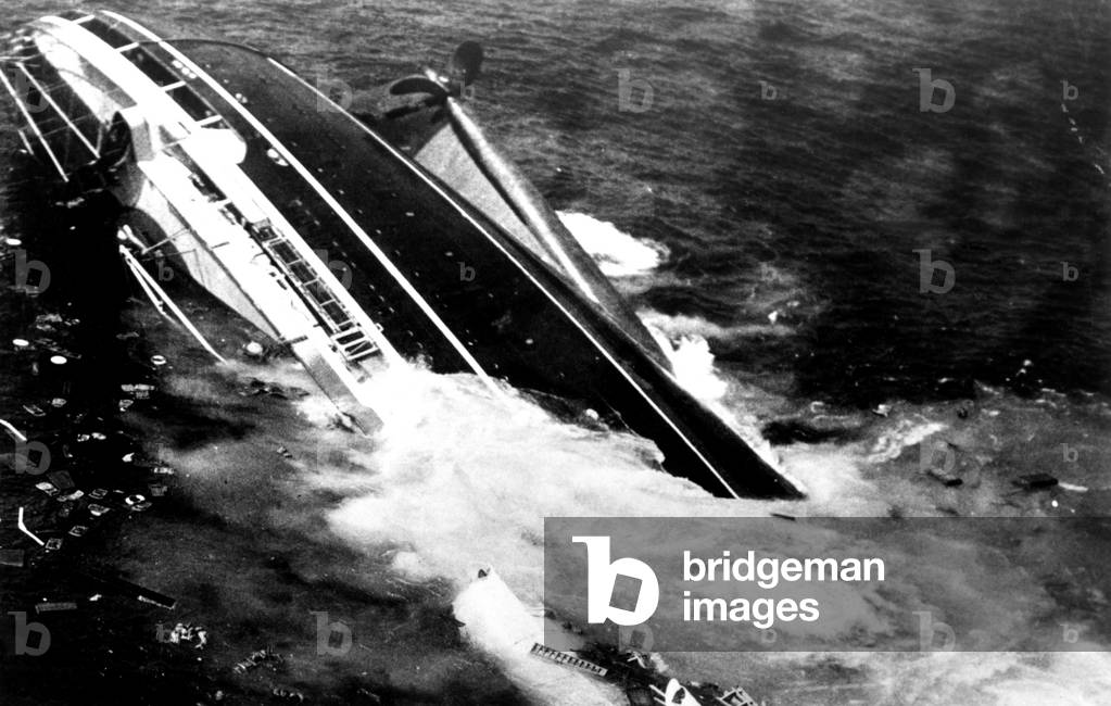 ANDREA DORIA, the Italian ocean liner is sinking in the ocean, 60 miles off of Nantucket Island, July 25, 1956, after its collision with the Swedish liner, Stockholm, at 11:10 PM.