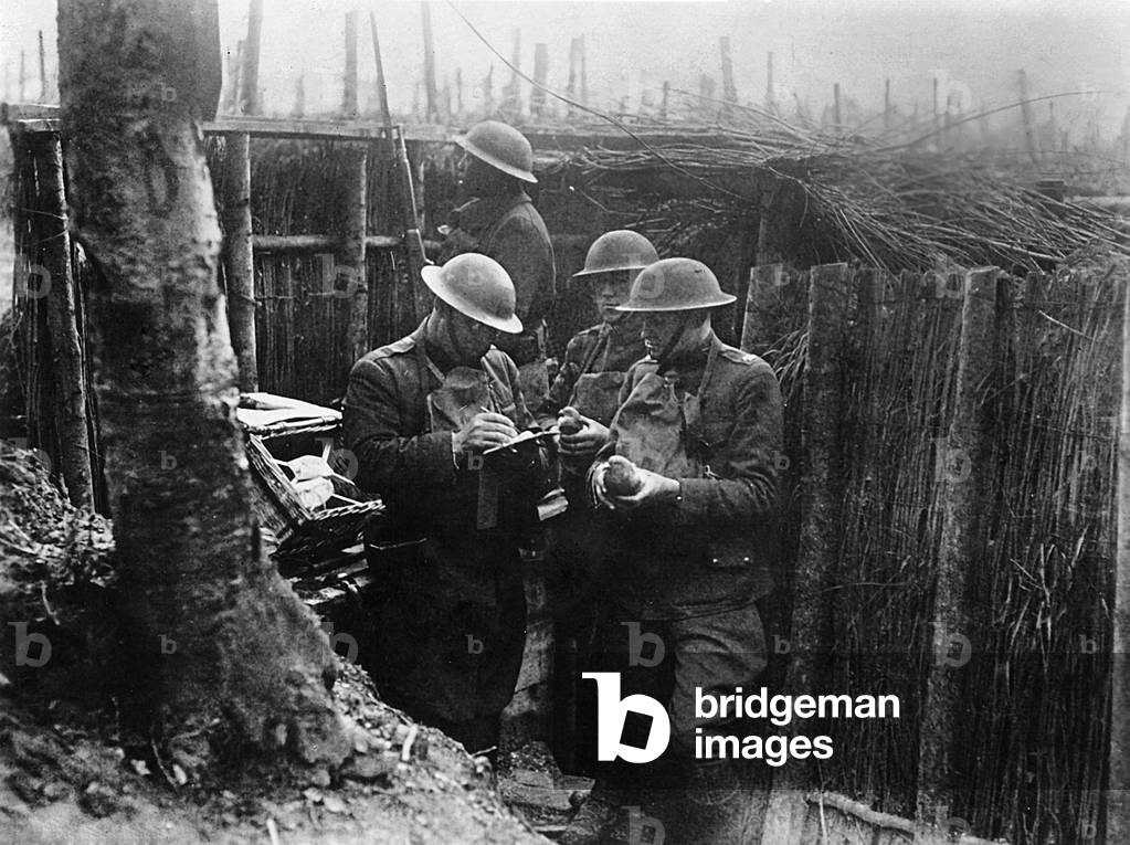 WORLD WAR 1: soldiers (American?) in the trenches with carrier pigeons, date on photo says July 18, 1918