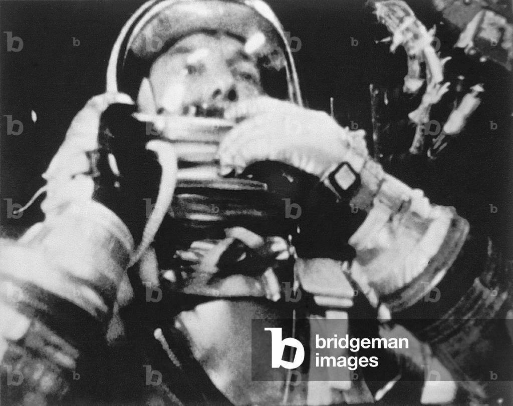 Astronaut Alan Shepard inside the Freedom 7 spacecraft during his historic fifteen and a half minute flight on May 5, 1961. Shepard is about to raise the shield in front of his face during descent