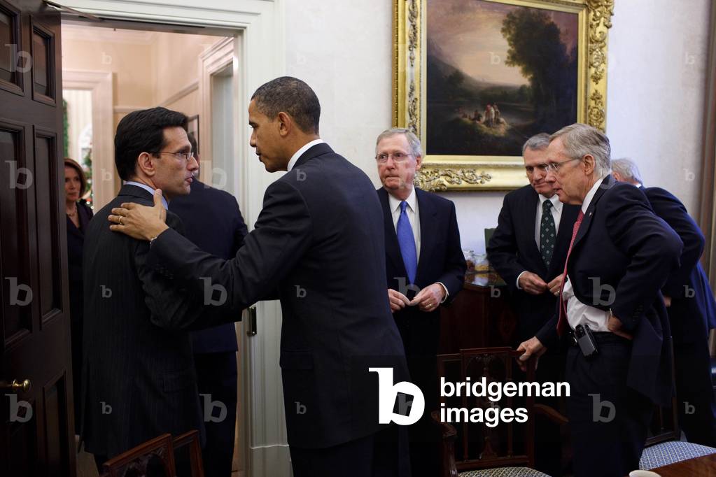 The President talks with Republican Majority Leader Eric Cantor at the end of a bipartisan meeting at the White House. At Obama's right stand Senate Leaders Mitch McConnell and Harry Reid. (BSWH_2011_8_147)