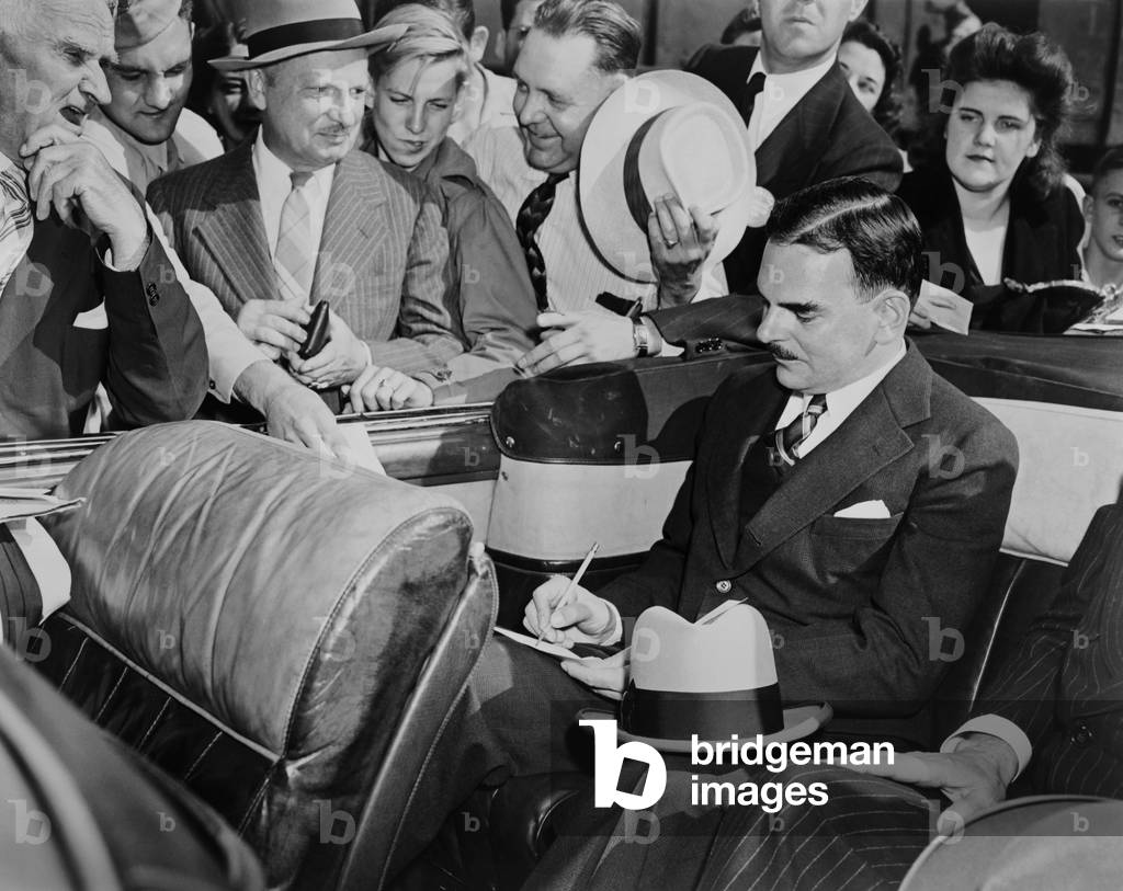 Republican Presidential candidate Thomas Dewey signing autographs in Louisville, Kentucky. Sept. 11, 1944. He lost to President Franklin Roosevelt, who won an unprecedented 4th term
