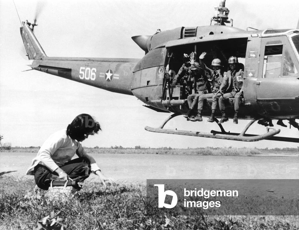 Vietnam War, South Vietnamese soldiers from the 9th ARVN Division wave as they depart the village of Cai Be, Vietnam, 12/04/72