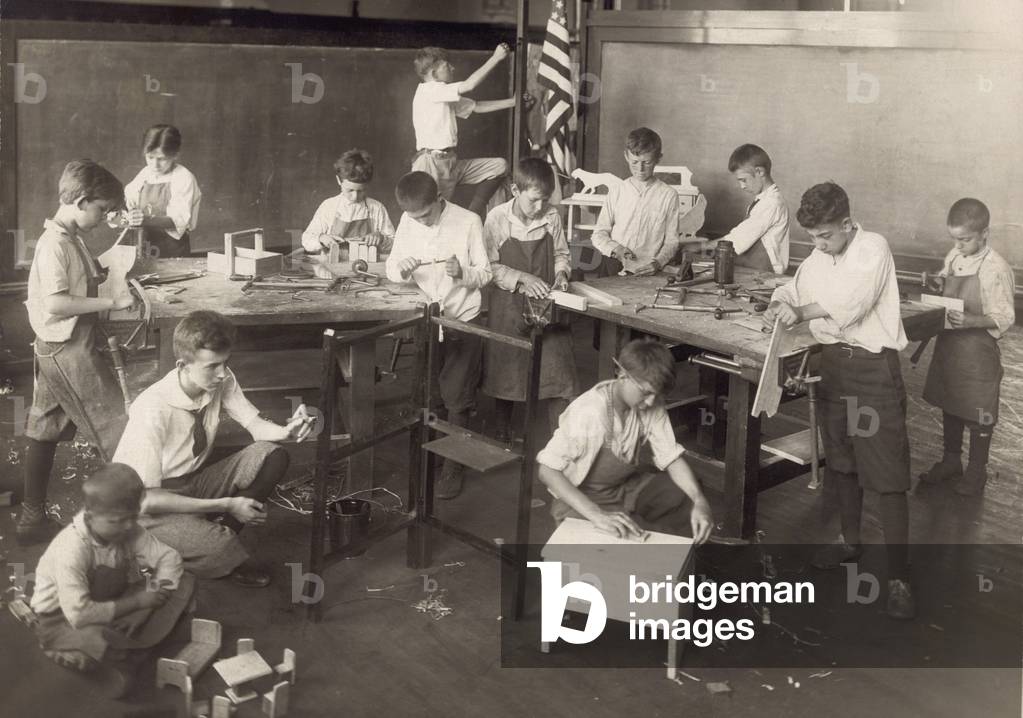 Boys learn carpentry in an open air summer school in Chicago in 1917