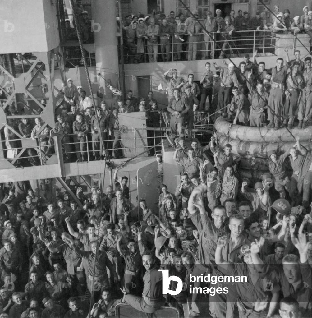 Soldiers of the U.S. 143rd Infantry cheer Italys unconditional surrender to Allied Nations. The Italian government surrended on Sept. 6, 1943 three days before the Allied landings on the Gulf of Salerno, south of Naples, Italy. World War 2