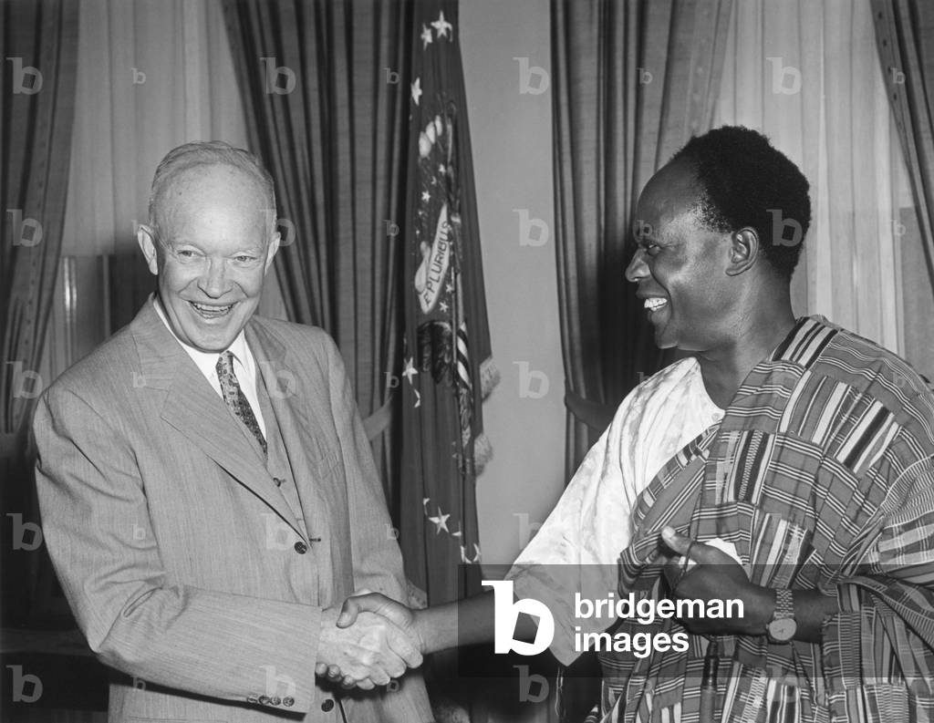 President Eisenhower with Kwame Nkrumah, President of Ghana. Nkrumah is wearing a traditional garment made of Kente Cloth. July 24, 1958. Oval Office