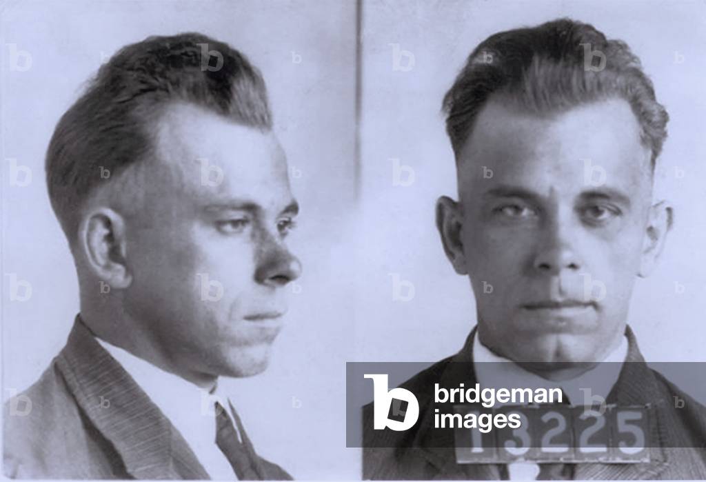 John Dillinger (1903-1934), in mugshot probably made during his eight and half year term in Indiana State Prison. Dillinger was played by actor Warren Oates in the 1973 movie DILLINGER, and by Johnny Depp in 2009 film, PUBLIC ENEMIES. c. 1925