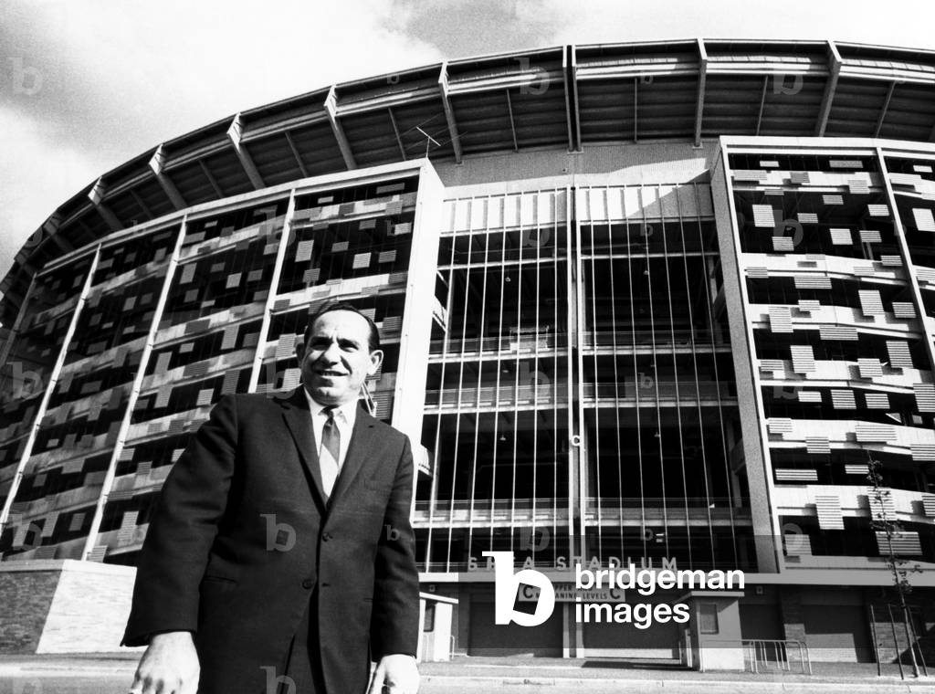 Yogi Berra stands outside Shea Stadium before signing a contract with the New York Mets, 1964
