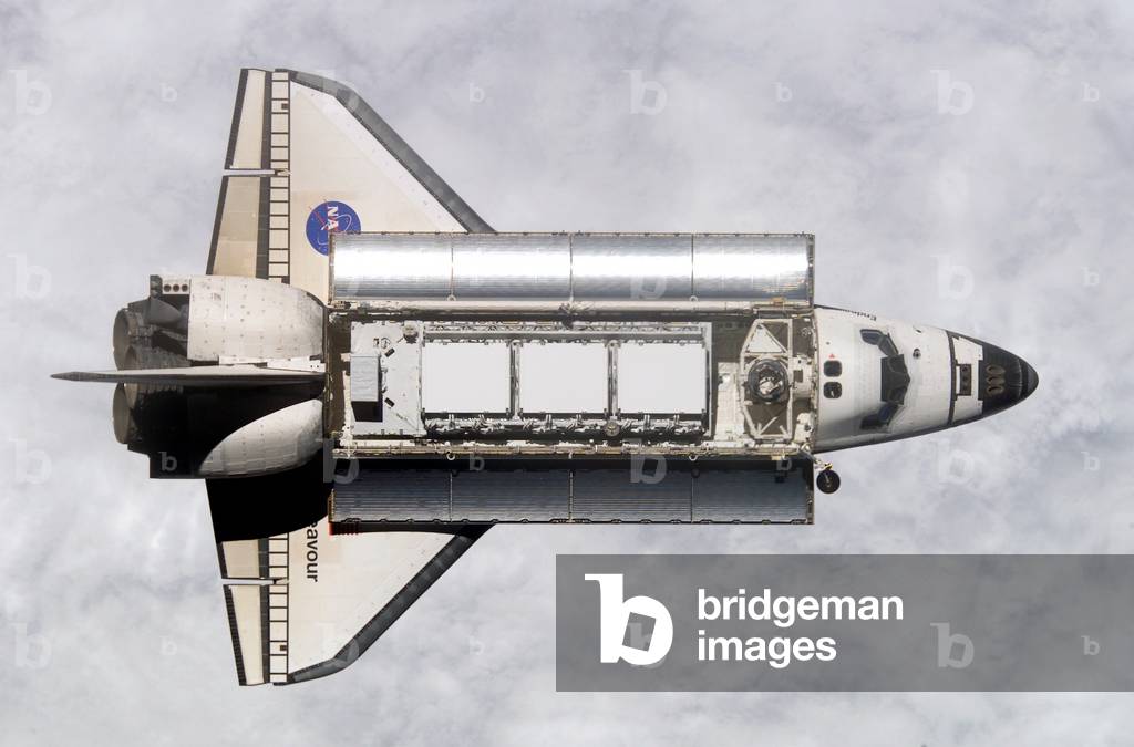 Space shuttle Endeavour approaching the International Space Station. Within the cargo bay are modules for expanding the space station. Nov. 25, 2002