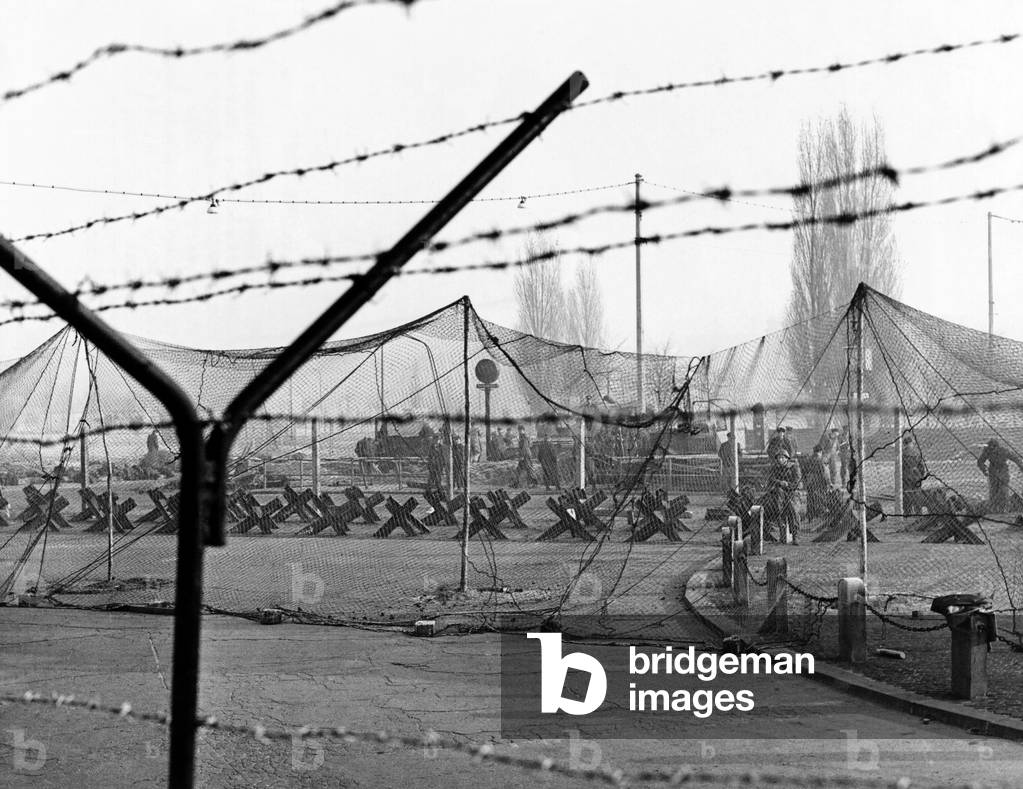 East Germany reinforces the concrete Berlin Wall. More barbed was strung on top of the wall. Steel girders in the ground and heavy netting form tank traps to protect against armored assault from the West. Nov. 20, 1961
